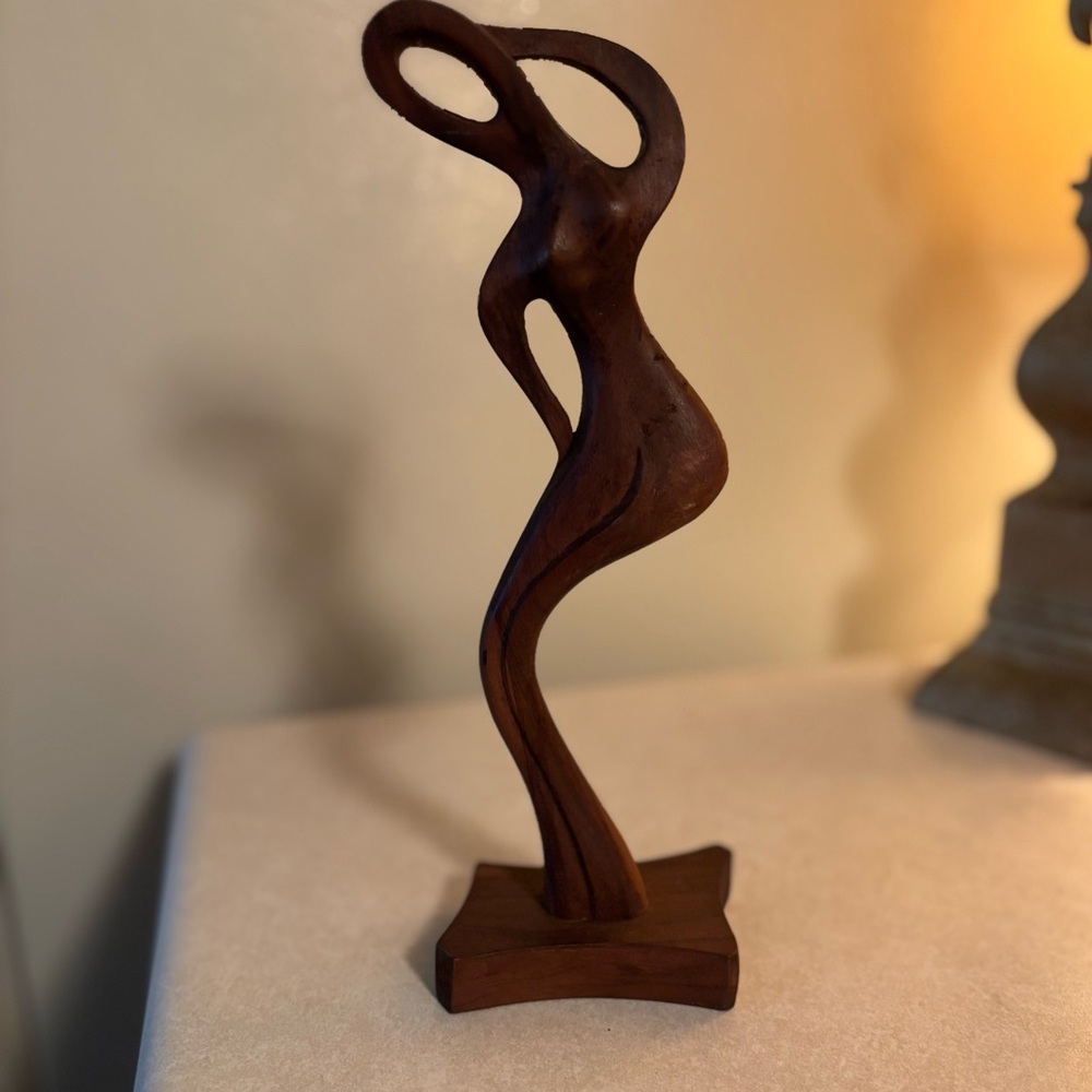 Handcarved wooden figure of a woman